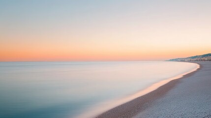 Fototapeta premium Soft pastel colors blend in serene sky above calm ocean waves at
