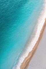 Gentle waves meet soft sandy shore, creating serene coastal scen