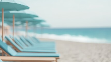 Obraz premium Sunlit beach scene featuring lined loungers and umbrellas, evoki