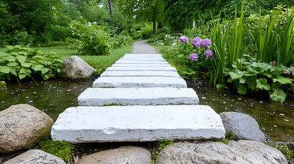 Obraz premium White stone path across stream, lush garden, tranquil scene, nature meditation