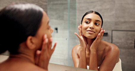 Bathroom, mirror and woman with face for skincare, self care and satisfaction for glowing in...