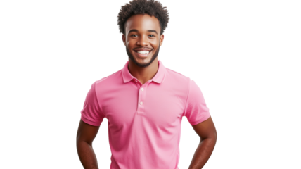 Smiling man in pink polo shirt posing confidently with hands on hips in bright setting