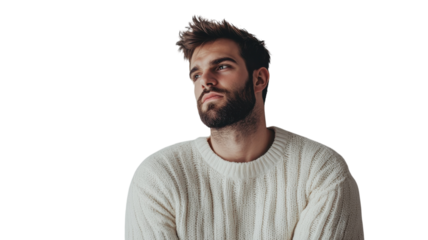 Young man in cozy sweater poses thoughtfully against plain background, showcasing casual style and relaxed demeanor