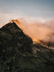 Landscape view of sun hitting clouds on a mountain top © Nathaniel