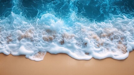 Fototapeta premium Ocean waves crashing on sandy beach, sunset backdrop, summer travel