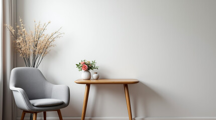 A gray armchair beside a wooden table adorned with flowers.