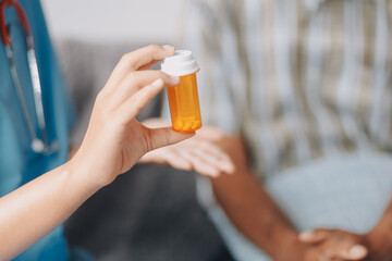Female doctor discusses medication with patient