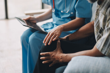 Fototapeta premium Caregiver doctor or nurse training stretching leg and knee with patient senior man for physical therapy and rehabilitation, physiotherapist assistance elderly exercising, medical and insurance.