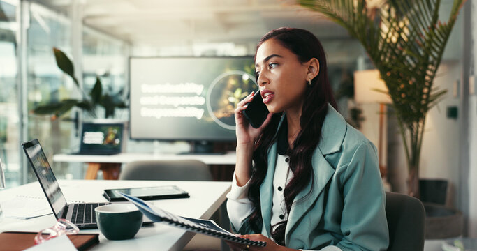 Business woman, talking and laptop with phone call for advice, eco friendly organisation or discussion at office. Female person, environmentalist or consultant on mobile smartphone for green project