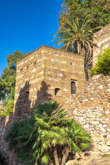 Alcazaba, palace and fortification in Malaga city at Andalusia, Spain, Europe. Ancient stone tower...
