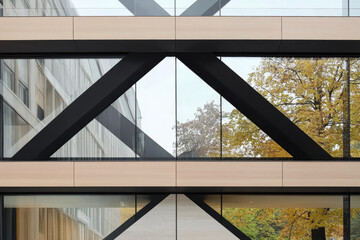 Fototapeta premium Modern architecture showcases glass and wood with a striking geometric design in autumn