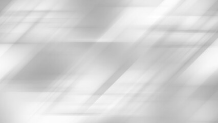 Abstract gray background features diagonal light streaks and shadows..