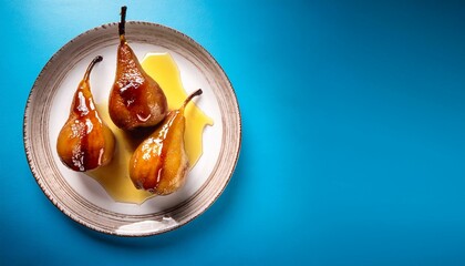 Fresh healthy baked pears with syrup on blue background
