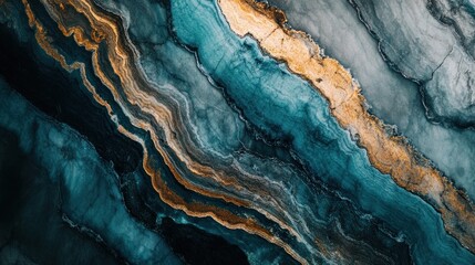 Obraz premium Abstract blue and gold marble texture with flowing patterns.