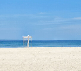 Minimalist Beach Scene with Goalpost and Clear Blue Sky