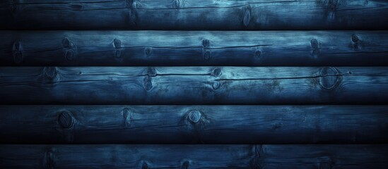 Dark blue wooden wall texture with horizontal log paneling, ideal for backgrounds and text placement, featuring rich tones and rustic appeal.