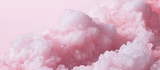 Soft pink mineral textures with white crystalline formations on a light pink background showcasing delicate layers and natural patterns.
