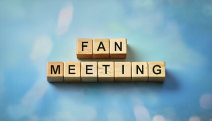 ファンミーティングを意味する英単語fan meetingの文字が書かれた木製のキューブブロック。 aiで生成	
