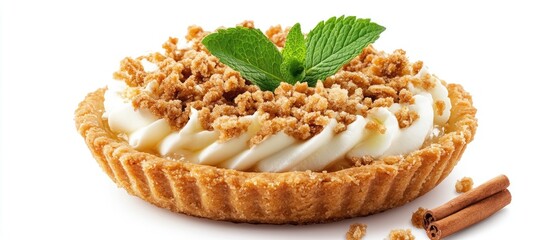 Creamy apple crumble pie with whipped cream and mint garnishing on a light brown crust with cinnamon sticks and crumbs positioned around.