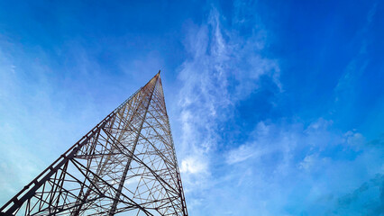 Selekti focuses on tv relay broadcasting tower from below