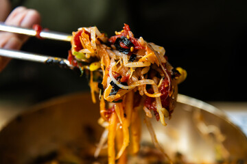 beef sashimi and bean sprouts seasoned with gochujang at the chopsticks