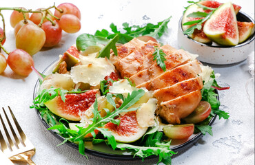 Delicious lunch with chicken, figs, cheese, grape and herbs. White background, top view