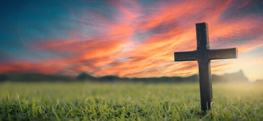 Silhouette jesus christ resurrection crucifix on cross on sunset background concept for good friday...