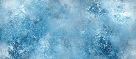 Fototapeta premium Abstract icy texture featuring shades of blue and white. The icy patterns blend seamlessly across the image, creating a cool winter atmosphere.