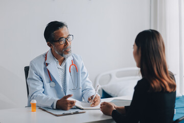 Doctor discussing with patient in hospital