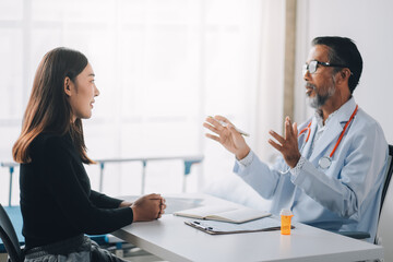 Doctor discussing with patient in hospital