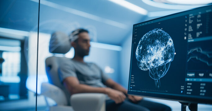Medical Brain Scan on Computer Screen. Advanced Neuroimaging Technology Reveals Complex Neural Pathways. Patient Connected to Advanced Brain Scan in the Background