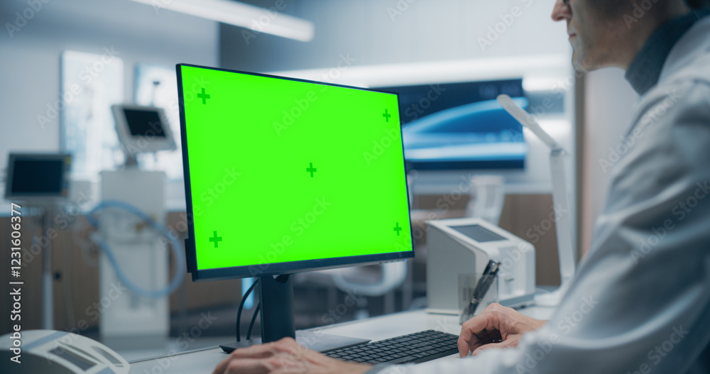 Poster a male scientist in a white lab coat works on a green screen computer in a advanced medical lab, foc
