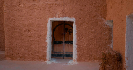 Room door in underground hotel in brick style colour theme.