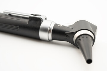 Otoscope isolated on white background for otolaryngologist or ENT physician doctor examining senior patient ear, hearing loss problem.