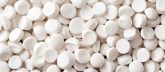 Lively composition of numerous white round tablets scattered prominently, conveying a sense of abundance and uniformity in pharmaceutical themes.