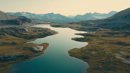 Fototapeta premium Aerial view of serene mountain lake, calm water, rocky landscape, background mountains, for travel brochures. Generative ai