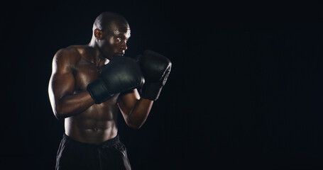 Black man, boxer fitness and studio for challenge, exercise and battle courage on background. Male...