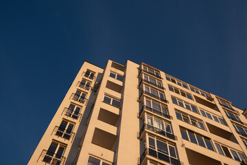 Fototapeta premium Modern Apartment Building Against Blue Sky