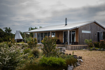 Fototapeta premium timber cabin remote holiday chairs porch relax escape 