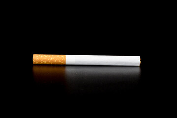 Cigarette butts isolated on black background