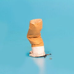 Cigarette butts isolated on blue background