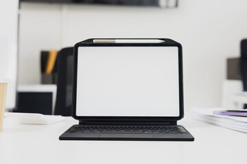 Fototapeta premium Modern Minimalist Workspace with Tablet and Accessories