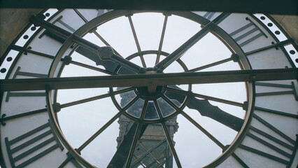 of clock intricate gears and hands, showcasing its detailed mechanism and craftsmanship. design reflects timeless elegance