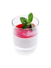 Creamy panna cotta dessert topped with vibrant raspberry sauce and fresh mint leaves in a glass