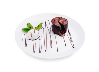 Delicious chocolate dessert with mint and ice cream served elegantly on a white plate
