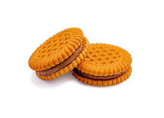 Cookies stacked on a white surface with a textured design and chocolate filling visible between them