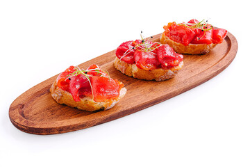 Deliciously crafted tapas served on a wooden platter with vibrant toppings at a modern culinary venue