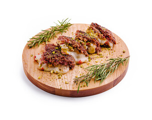 Delightful presentation of gourmet stuffed pastries on a wooden board with herbs and spices