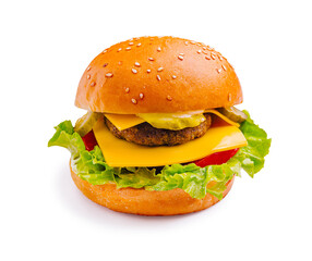 Delicious cheeseburger with fresh lettuce, tomatoes, and pickles served on a sesame seed bun
