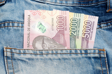 Angolan Kwanza in the pocket of blue jeans